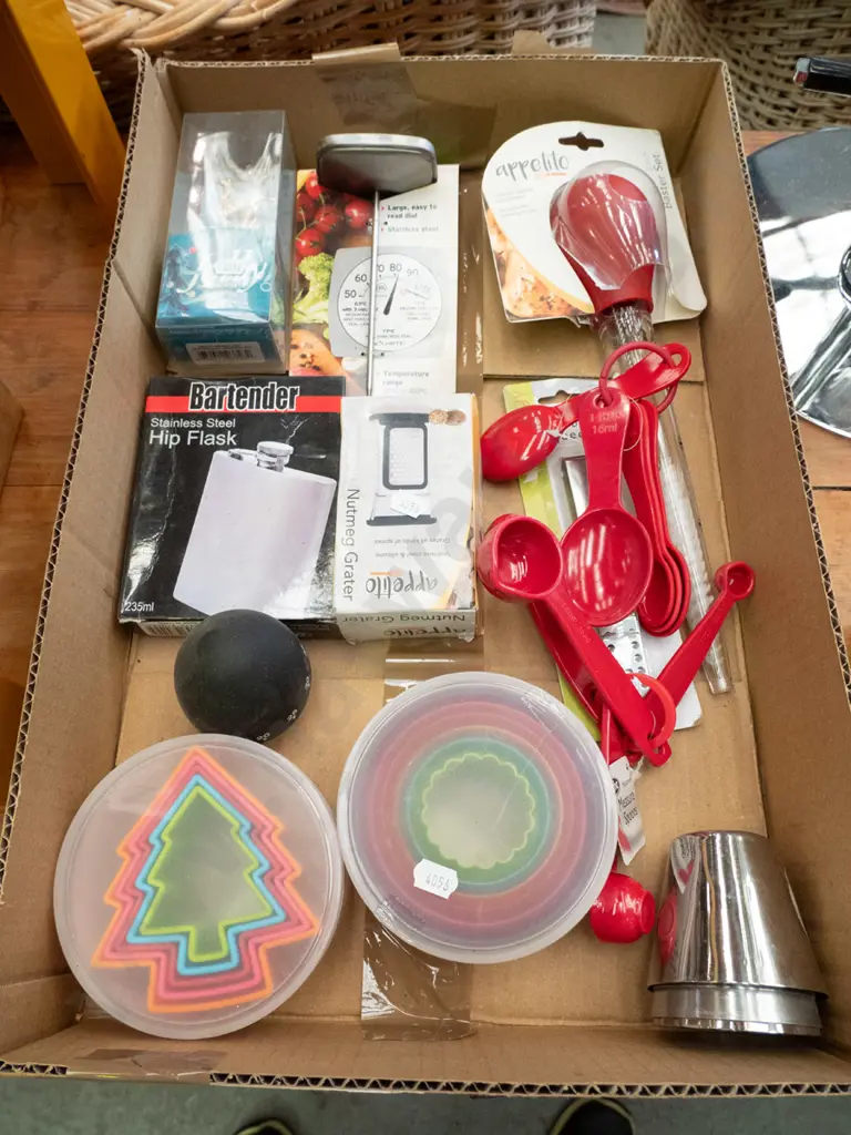 box of as-new cookie cutters, hip flask, meat thermometer, measuring spoons etc. Image 1++