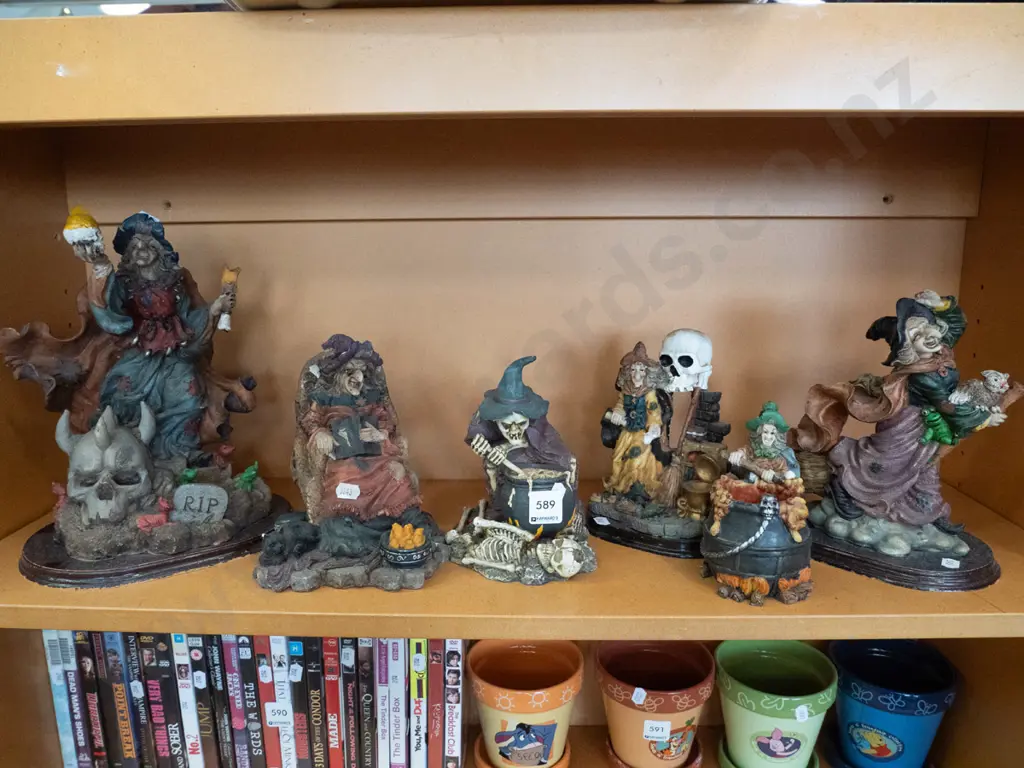 shelf of composite witch figurines Image 1++