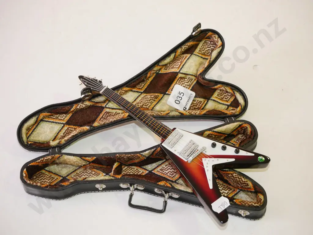 miniature ornamental electric guitar in case Image 1++