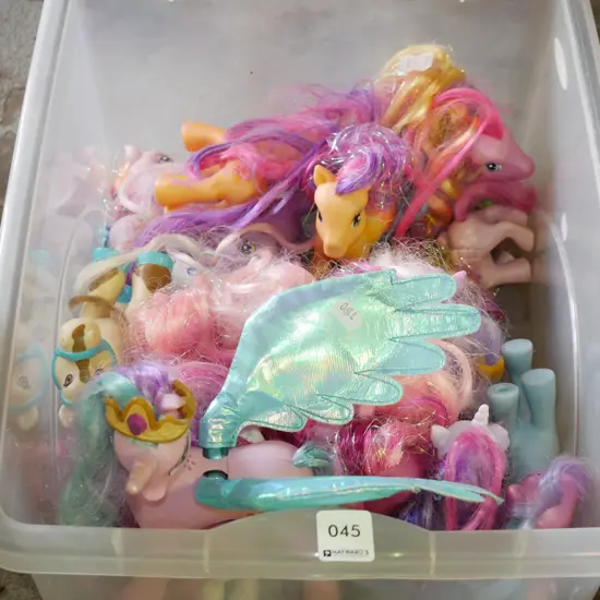 plastic tub of My Little Ponies