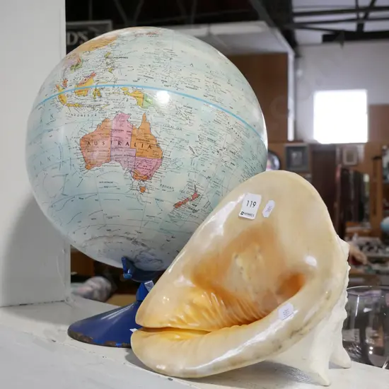 large seashell and world globe - rust on base