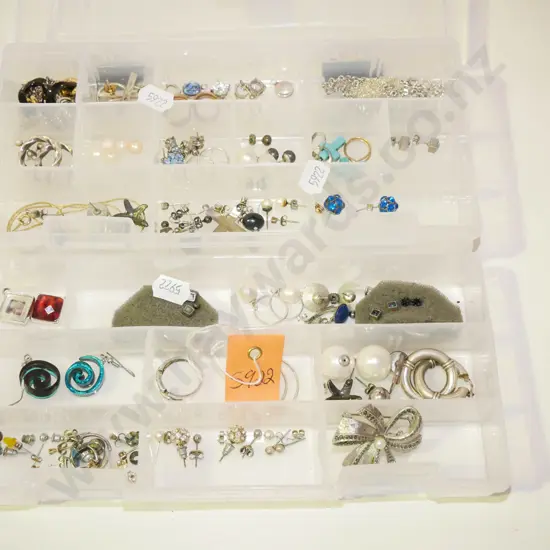 plastic tray of earrings