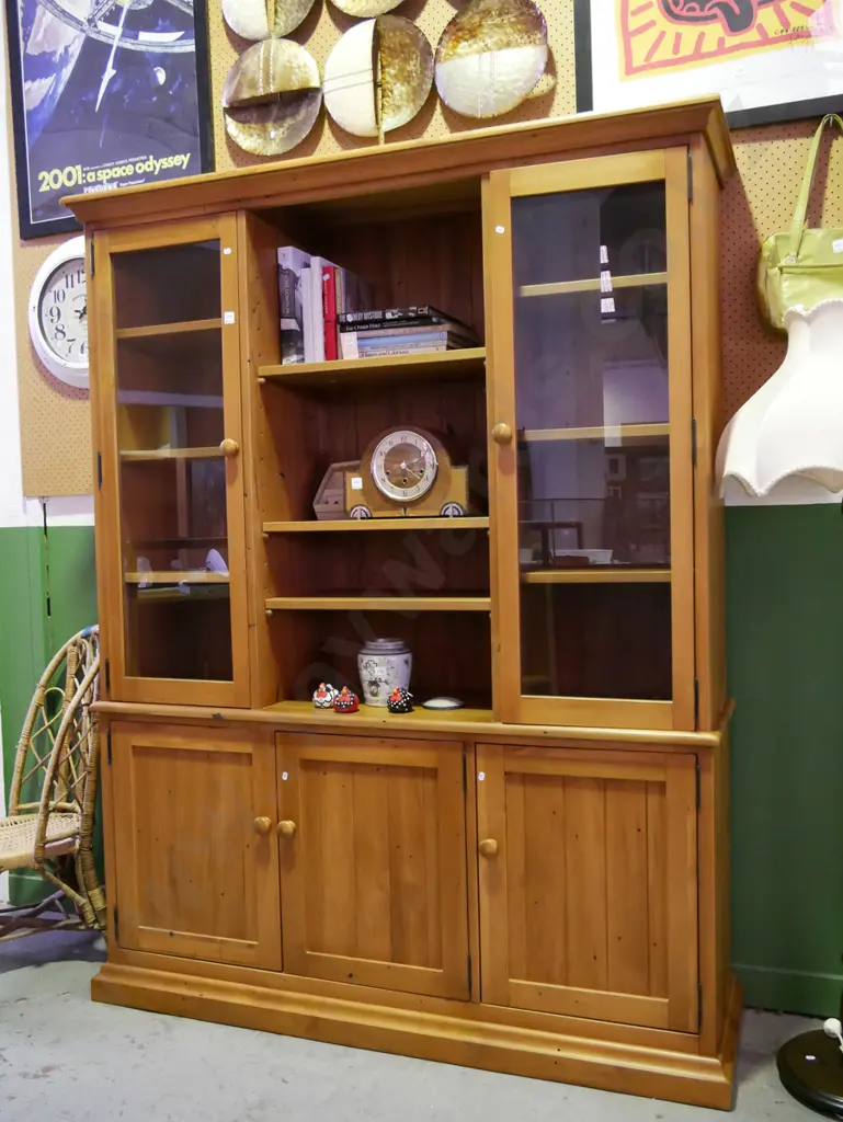 solid rimu wall unit with 2 glazed display doors and 3 solid doors with internal adjustable shelving Image 1++