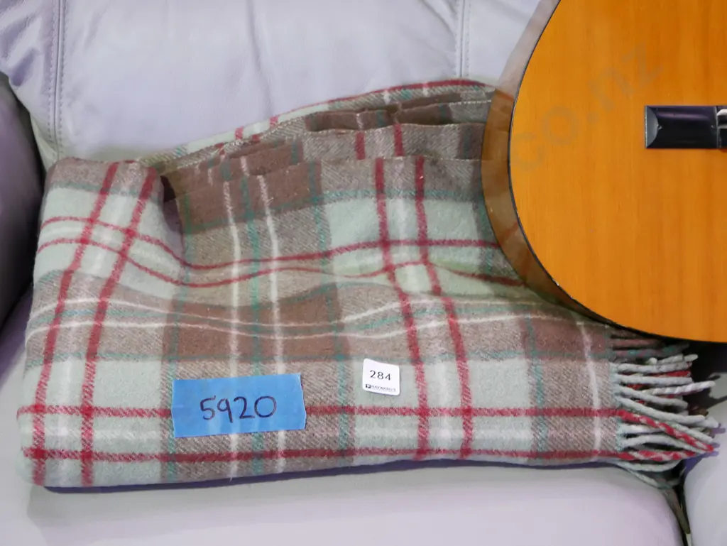 green, brown and red checked travel blanket Image 1++