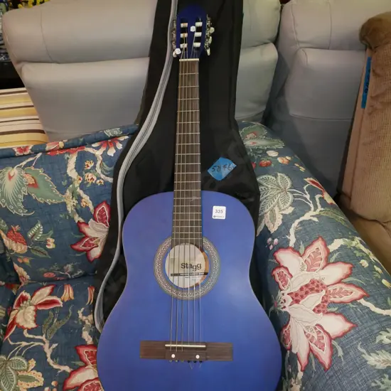 blue Stagg acoustic guitar and soft carry case