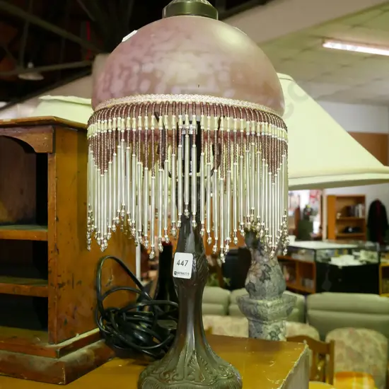 reproduction table lamp with mottled pink glass shade and lustres