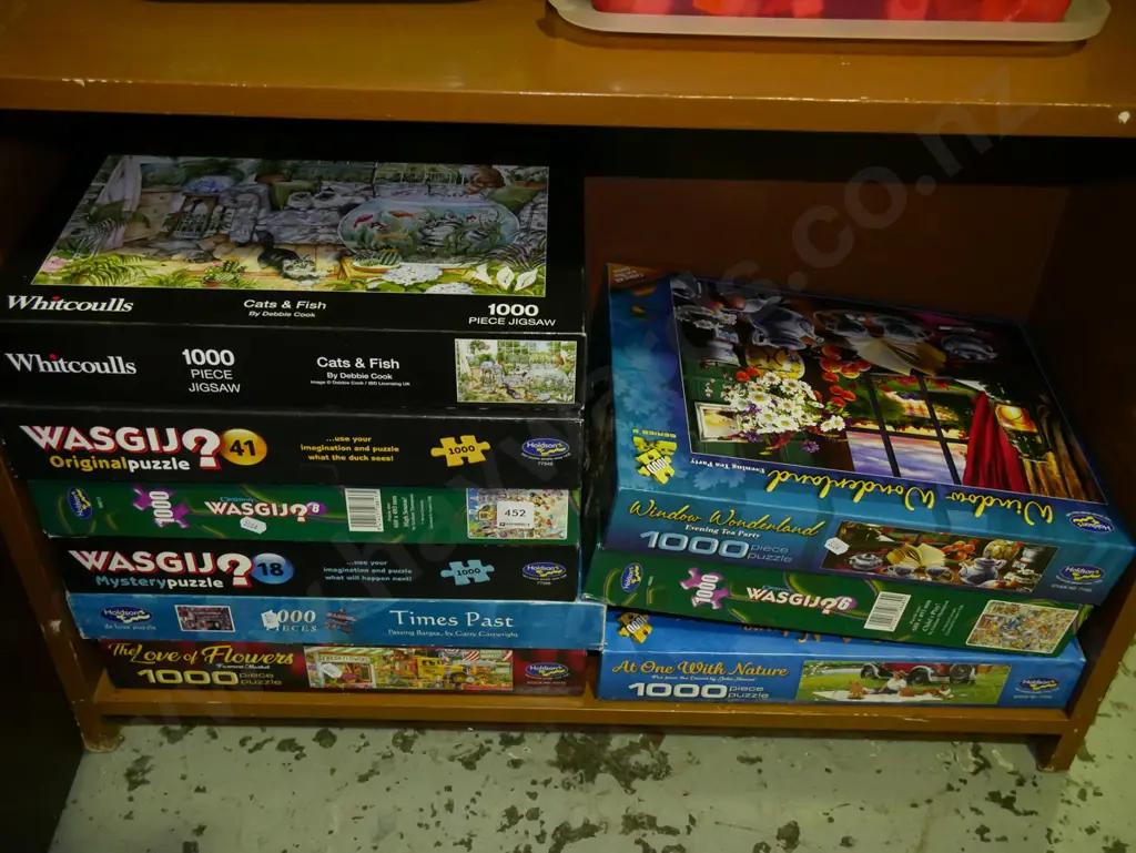 shelf of wasgij and other puzzles Image 1++