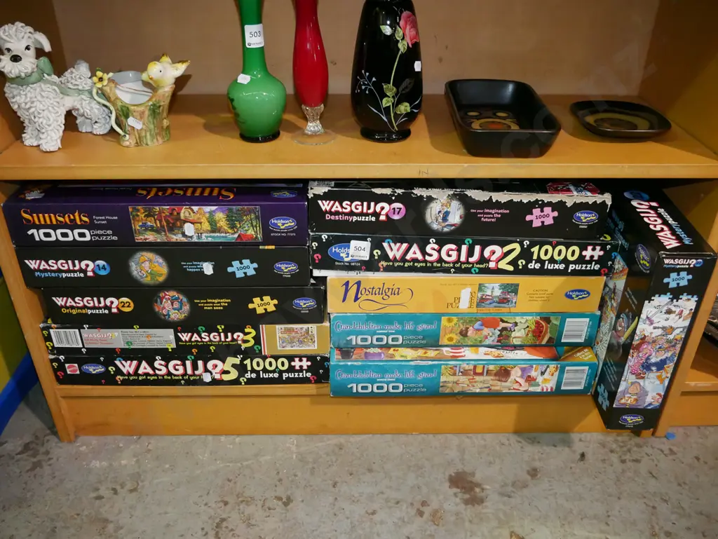 shelf of wasgij and other puzzles Image 1++