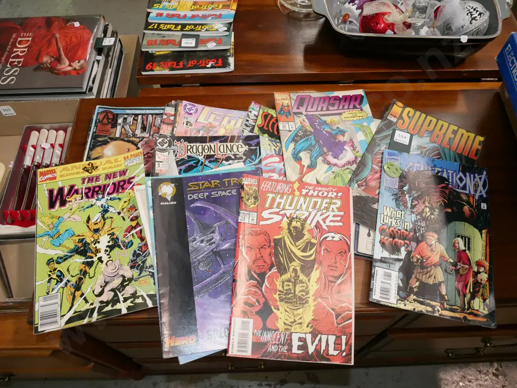 stack of comics Image 1++