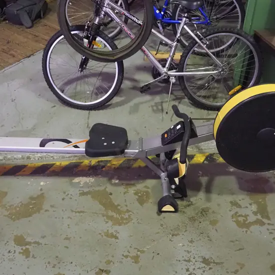 Track rowing machine