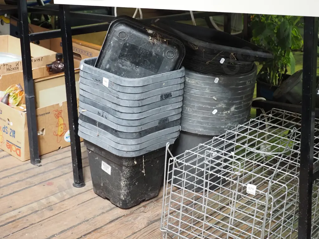 various black plastic planters in trays Image 1++