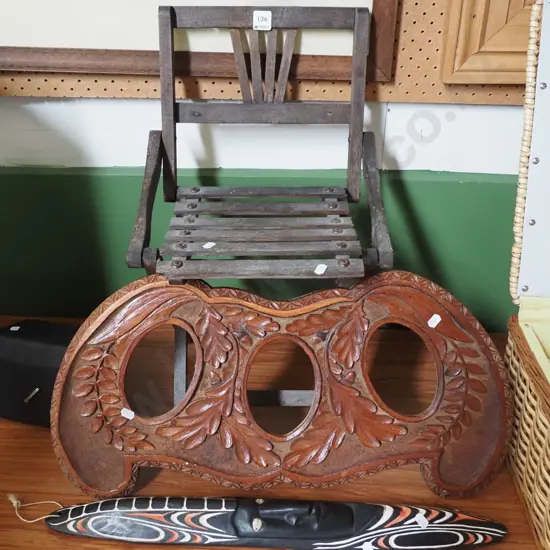 foldaway child's chair, souvenir mask, heavy carved triptych photo frame