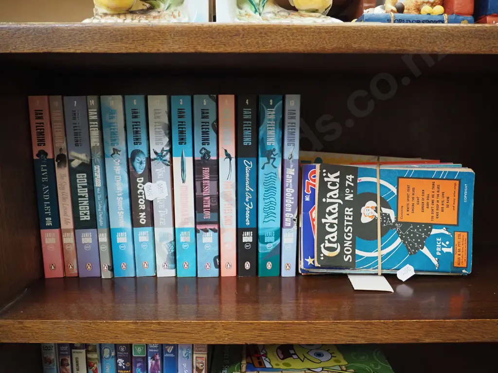back issues of Crackerjack song birds and Ian Fleming books Image 1++