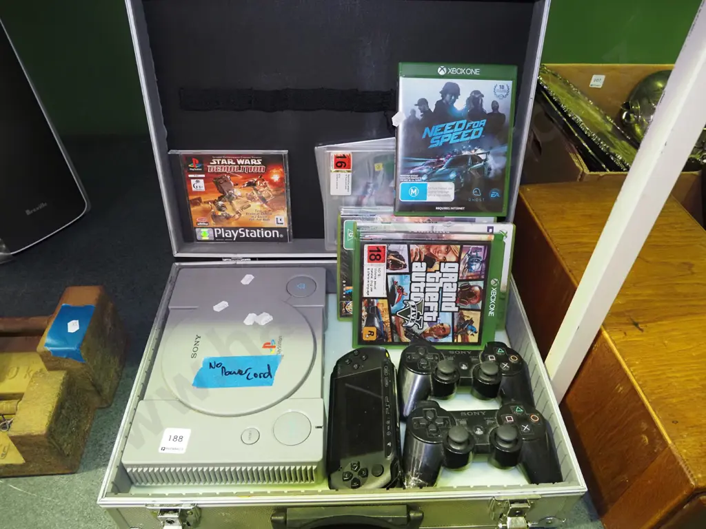metal equipment case with Playstation - no power cord 1 controllers, various X-box games etc Image 1++