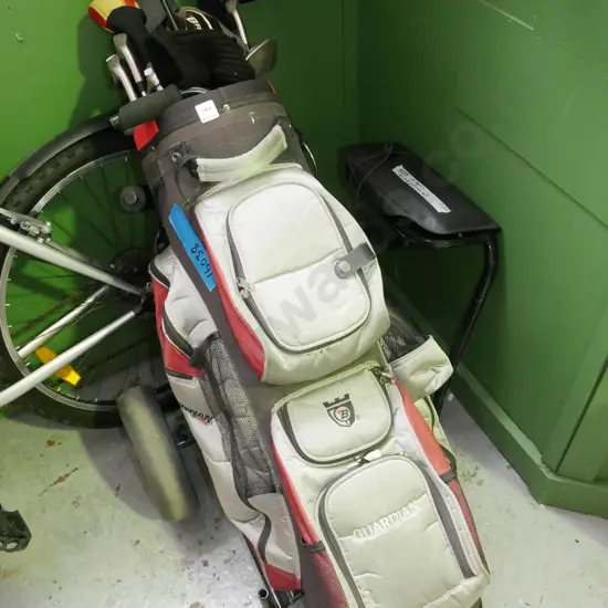 golf trundler and clubs