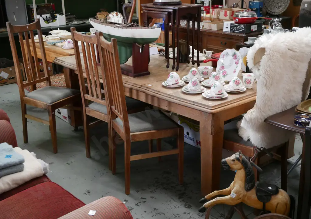 solid oak wind out dining table with 2 additional leaves with 4 upholstered chairs Image 1++
