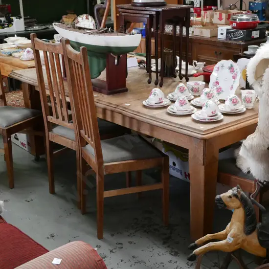 solid oak wind out dining table with 2 additional leaves with 4 upholstered chairs