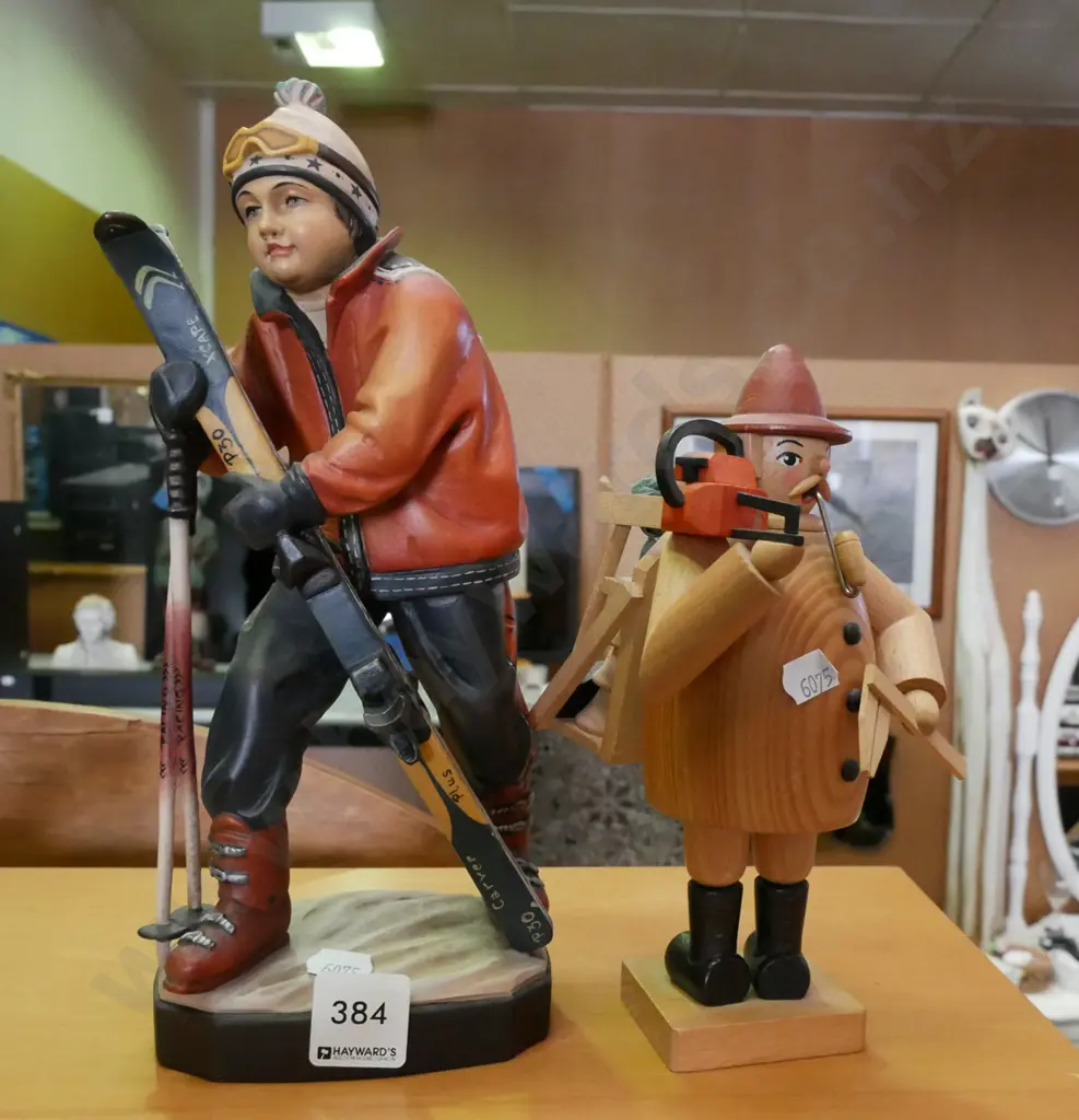 2x carved figurines  - wooden lumberjack, skier H-270 Image 1++