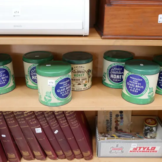 shelf of vintage honey tins