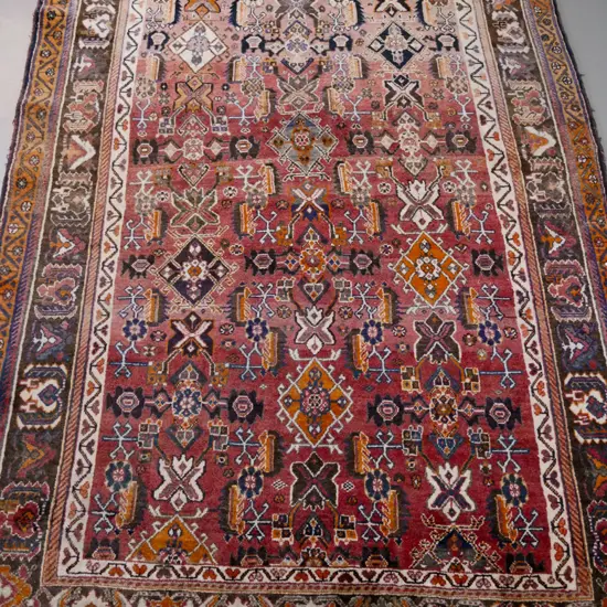 Iranian hand-knotted wool floor rug - reds, blues and saffron - fading, especially to one end L2510