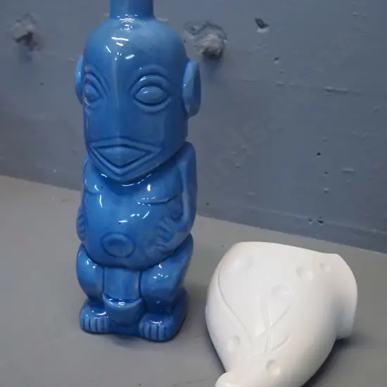 Royal Norfolk deco style wall pocket vase and a tiki figural motif blue glaze bottle H-280