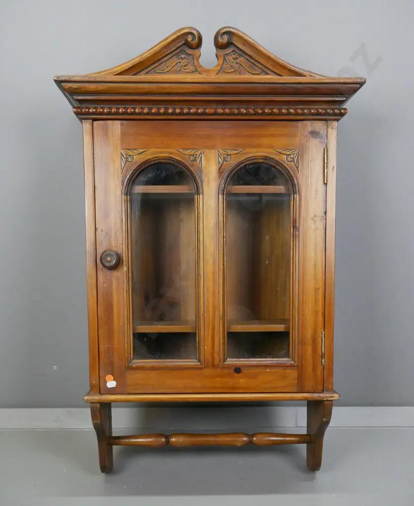 vintage pine wall-hanging cupboard with carved swan-neck pediment, door with 2 arched glazed panels, wooden knob, turned Image 1++