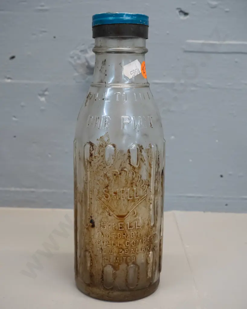 Shell New Zealand One Pint oil bottle with metal cap marked Shell X-100 motor oil Image 1++