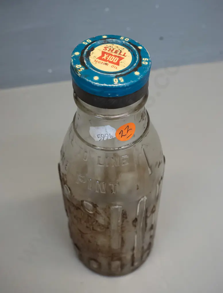Shell New Zealand One Pint oil bottle with metal cap marked Shell X-100 motor oil Image 1++