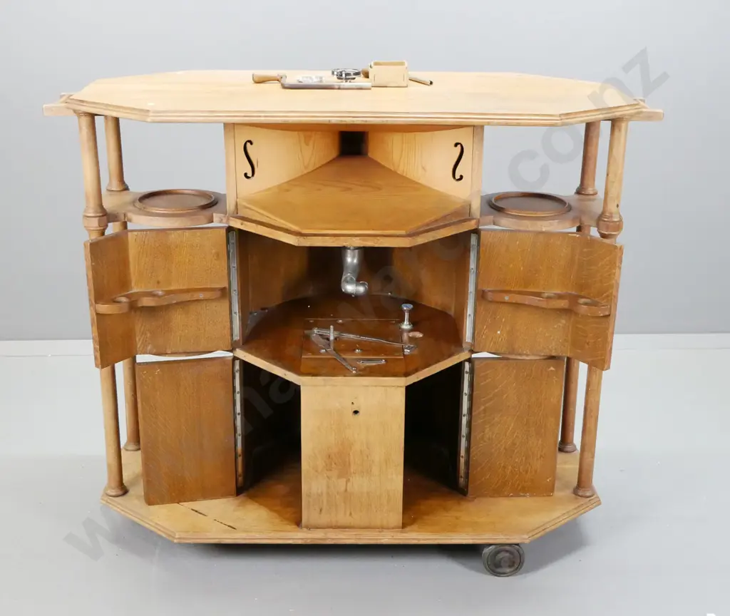 vintage oak gramophone cabinet / tea trolley with turned columns, display shelves, integrated speaker horn and partial Image 1++