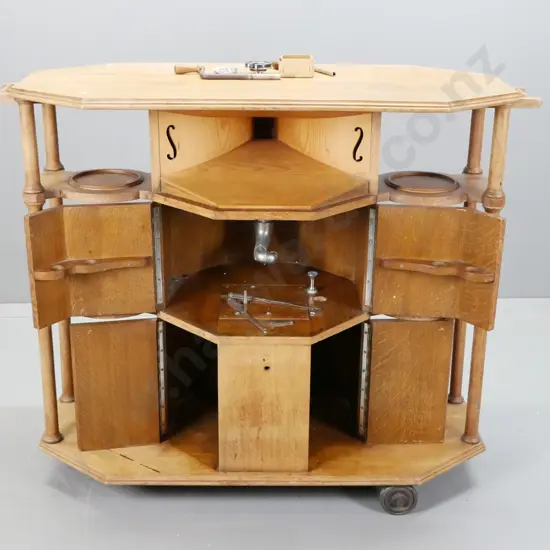 vintage oak gramophone cabinet / tea trolley with turned columns, display shelves, integrated speaker horn and partial