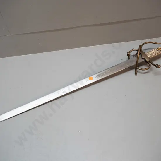 reproduction short sword with faux bone composite handle, brass fittings, etched blade marked Toledo Spain. L-720