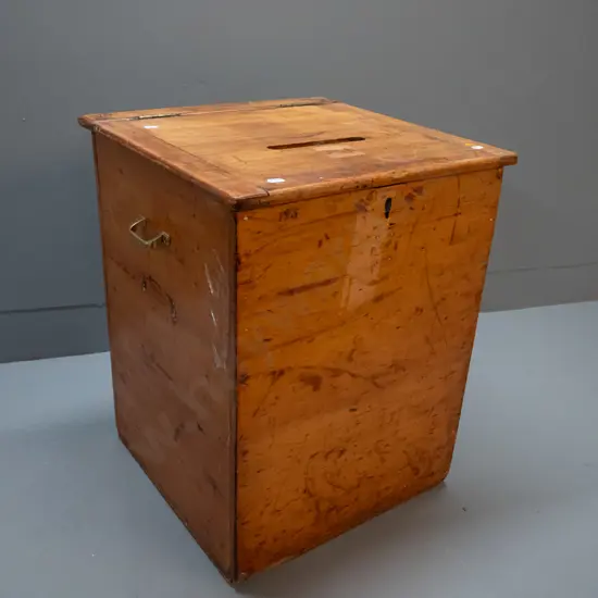 vintage kauri ballot box with hinged lid, brass side handles, marked NZ with broad arrow on top and No. 113 on front,