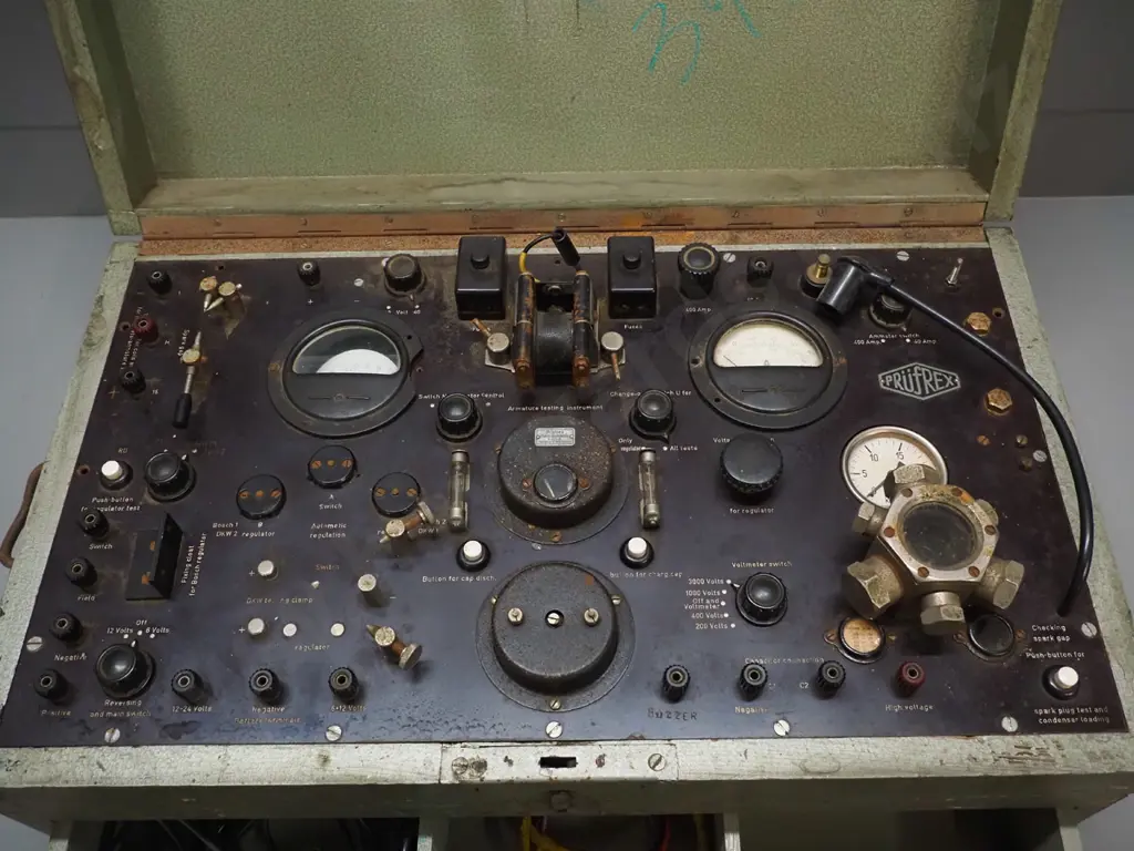 vintage timber cased Prufrex Universal automotive electrical testing device with assorted cables and other items in Image 1++