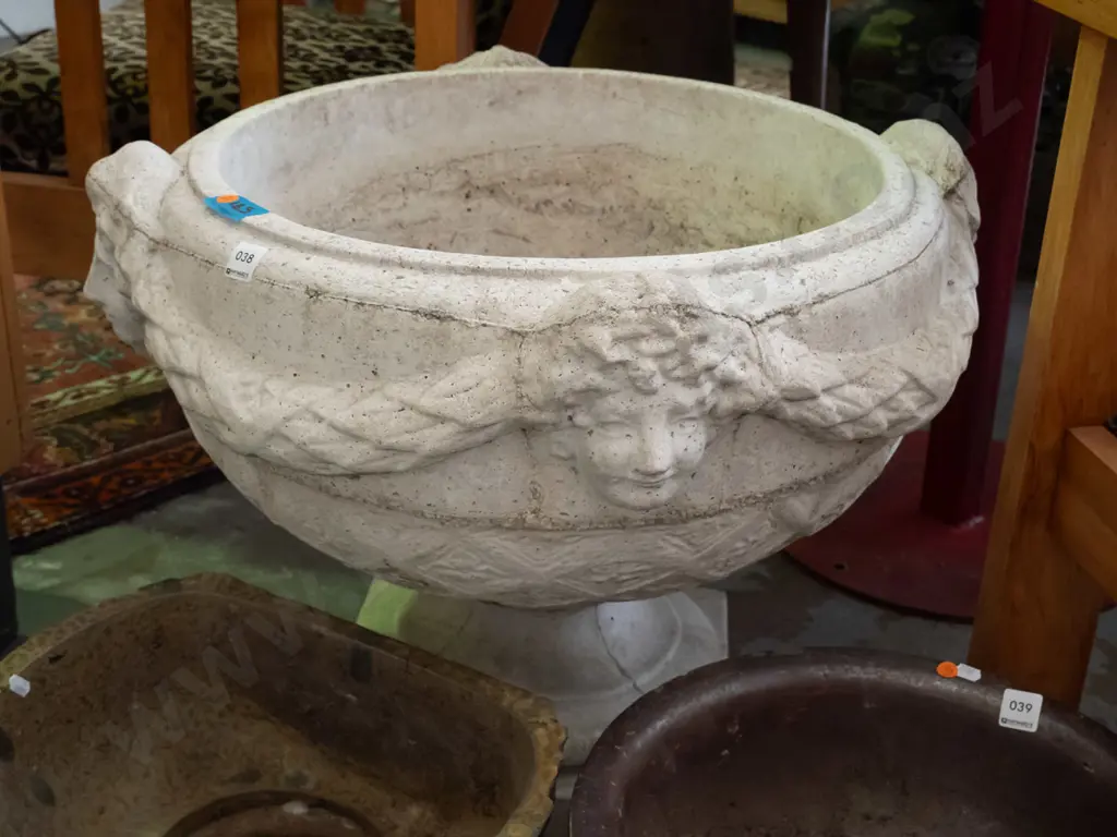 large cast concrete classical style garden urn w/ intertwined swags and female heads, pedestal base on square foot - Image 1++