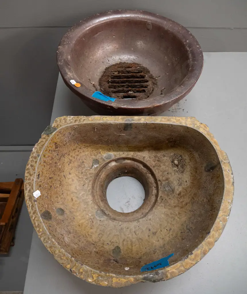 2 salt glazed storm drain traps, round one marked JH Lambert Dunedin, has rusted metal grate, no maker's marks on other Image 1++