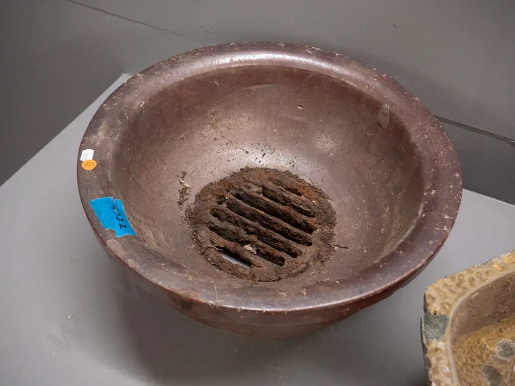 2 salt glazed storm drain traps, round one marked JH Lambert Dunedin, has rusted metal grate, no maker's marks on other Image 1++