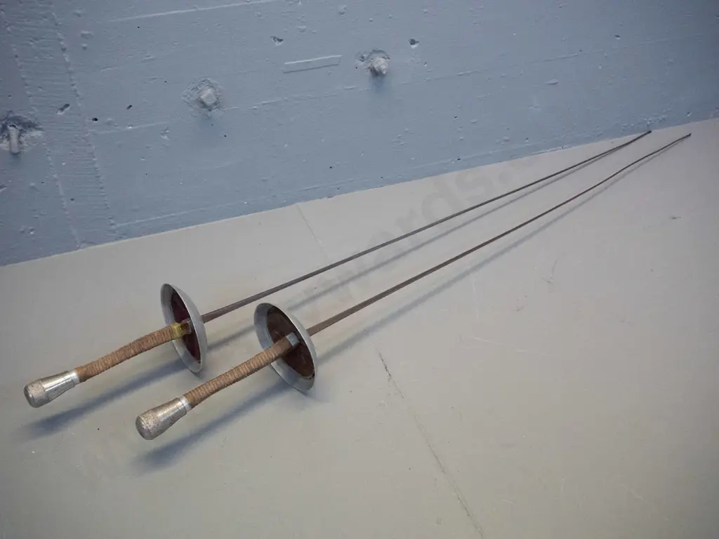 pair of vintage fencing foils with waxed cord wound handles, leather inset in hilt - made in France. One handle has been Image 1++