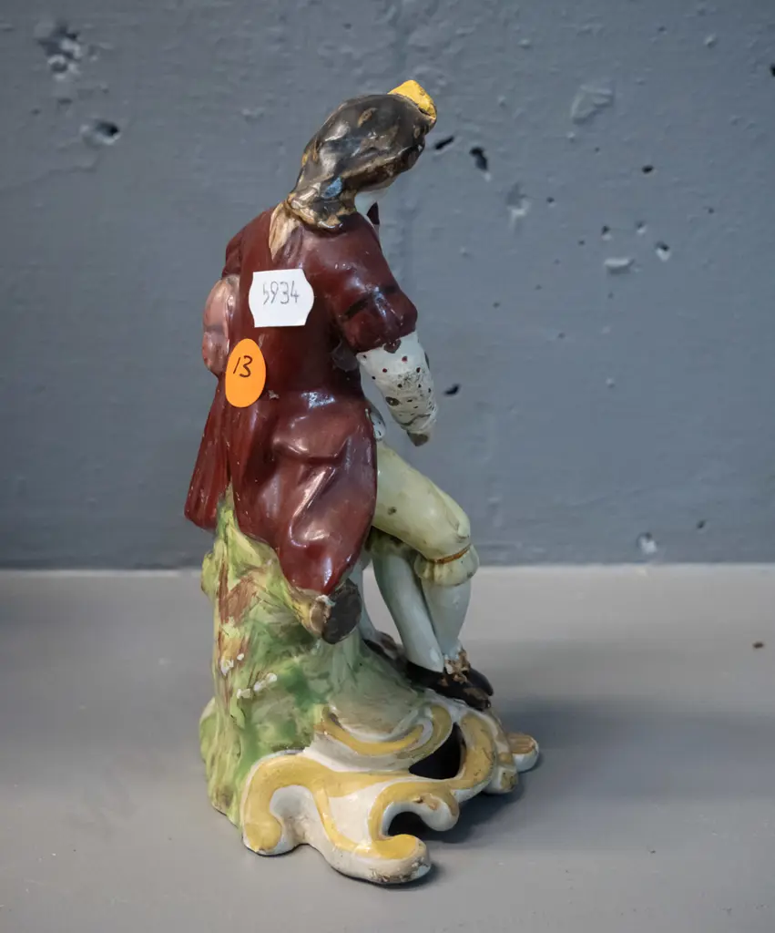 small figurine of man playing bagpipes - has been marked on base "Chelsea Derby circa 1785" - some damage to pipes H-160 Image 1++