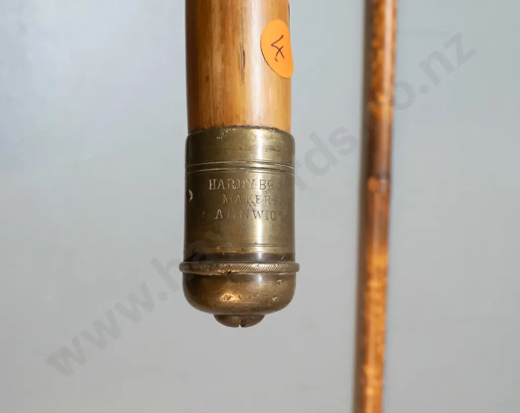 2 vintage bamboo fishing items with brass end fittings - one with threaded end cap marked Hardy Bros. Makers Alnwyck & Image 1++