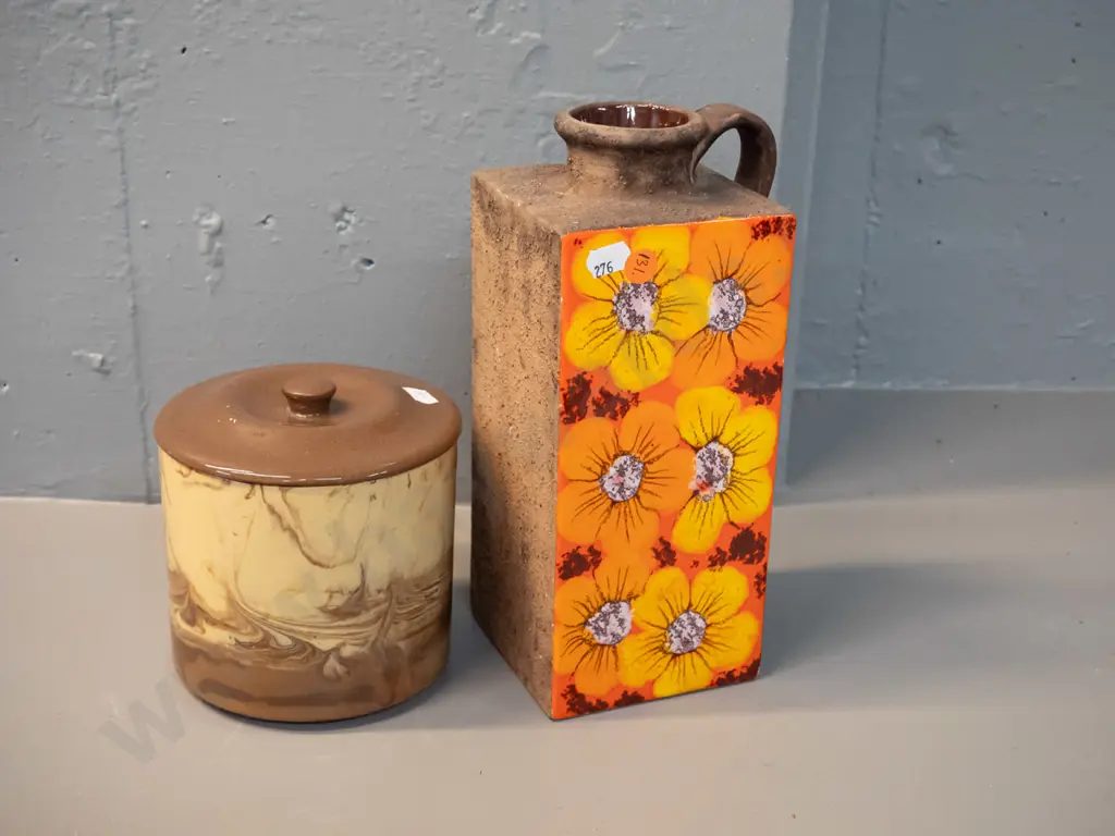2 pieces of studio pottery - Te Rona lidded pot and a retro slab sided rough textured jug vase with one glazed floral Image 1++