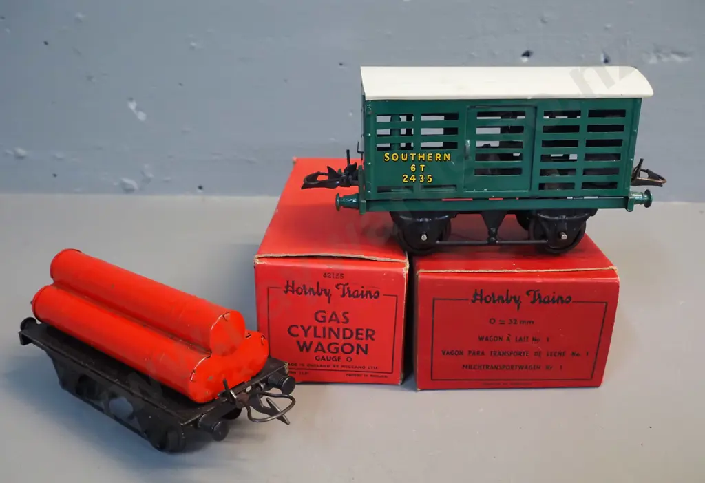 Hornby Gauge O model railway rolling stock - flatbed with container, gas cylinder wagon and milk van, all with original Image 1++