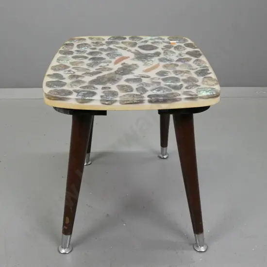 mid-century occasional table with paua shell NZ map decoration and fern fronds, set in resin or plastic, round legs w/