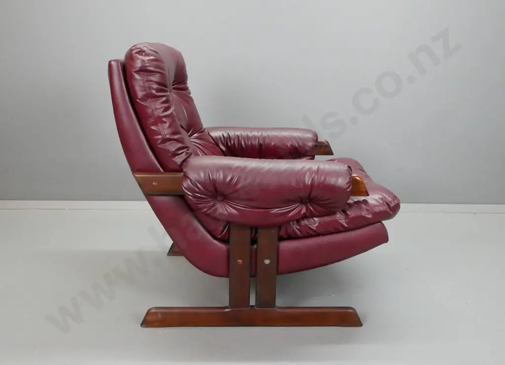 pair of maroon or dark red deep-button vinyl upholstered lounge chairs with timber slatted & rail base H-840 W-770 D-720 Image 1++