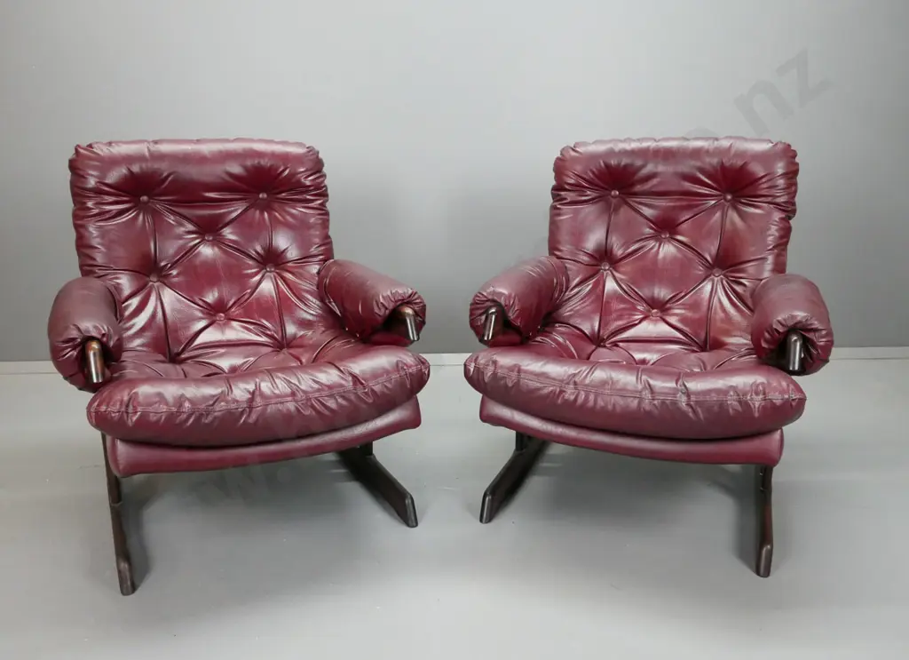 pair of maroon or dark red deep-button vinyl upholstered lounge chairs with timber slatted & rail base H-840 W-770 D-720 Image 1++