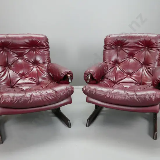 pair of maroon or dark red deep-button vinyl upholstered lounge chairs with timber slatted & rail base H-840 W-770 D-720