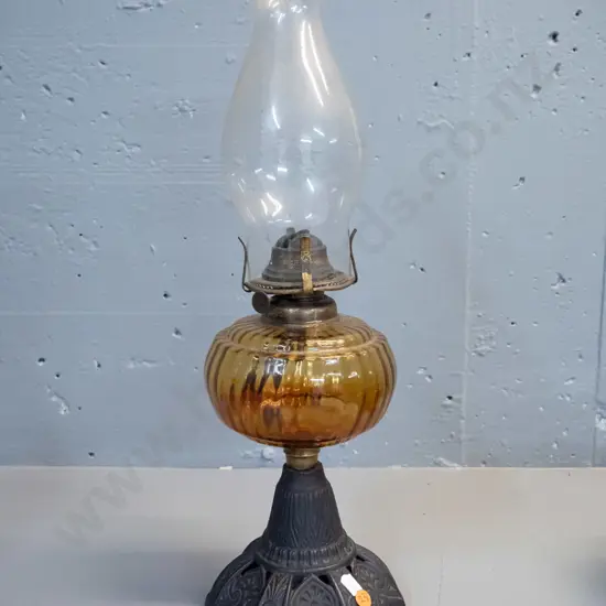 vintage kerosene lamp with cast metal base, amber glass reservoir and clear glass chimney H-500