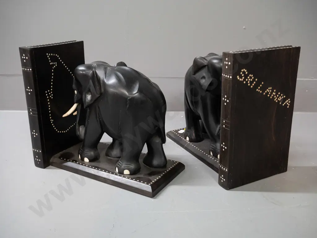 pair of ebony elephant book ends with shallow inlay dot pattern decoration, marked Sri Lanka - some chips and repaired Image 1++