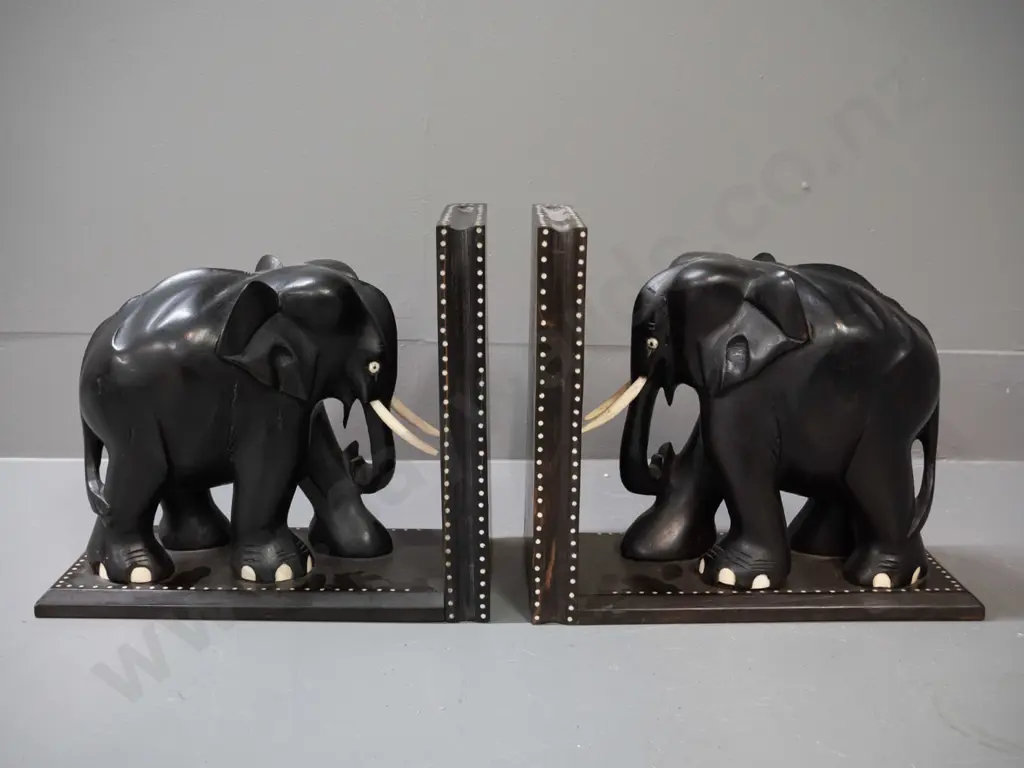 pair of ebony elephant book ends with shallow inlay dot pattern decoration, marked Sri Lanka - some chips and repaired Image 1++