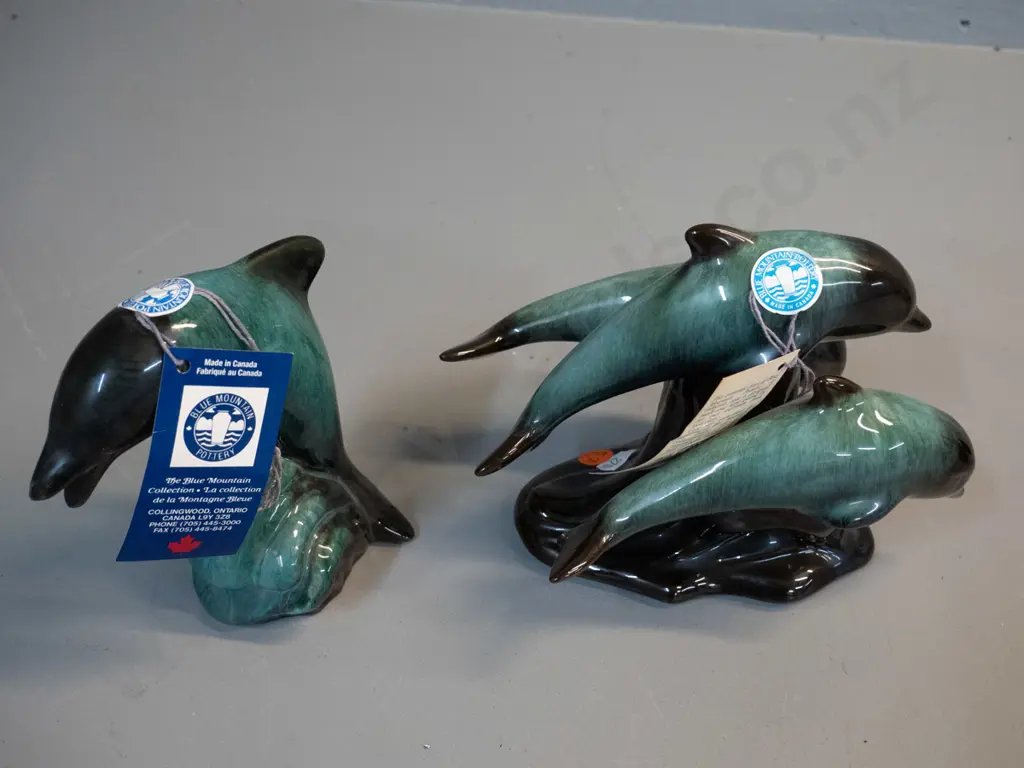 2 Blue Mountain pottery figures with original hang tag and label - 3 leaping dolphins H-155 L-195 and a single dolphin Image 1++