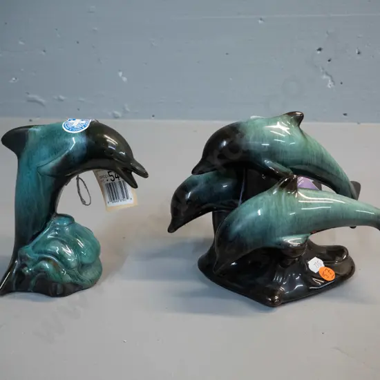 2 Blue Mountain pottery figures with original hang tag and label - 3 leaping dolphins H-155 L-195 and a single dolphin